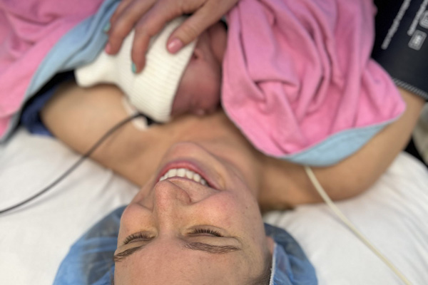 Carmen having skin-to-skin with Charlotte in the OR - Carmen's Bump Day Blog: Charlotte Lucia's Birth Story