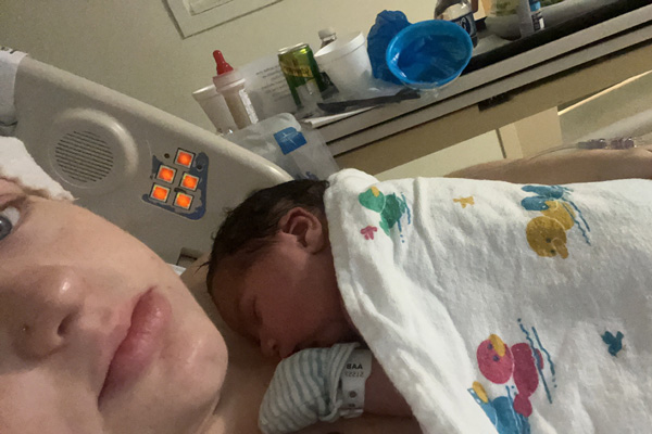 Haylie holding her baby shortly after birth - Chosen: A Rainbow Birth Story